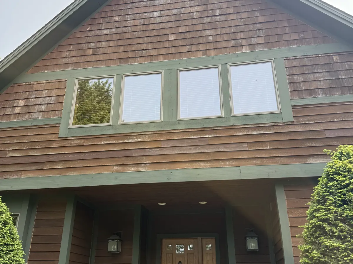 Home with weathered, faded wood siding before its remodel