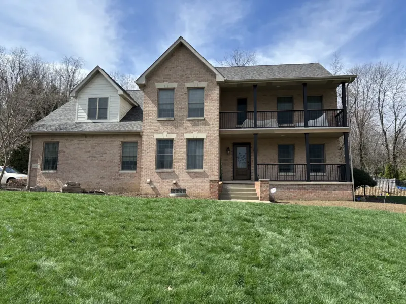 New gable siding and two-story porch