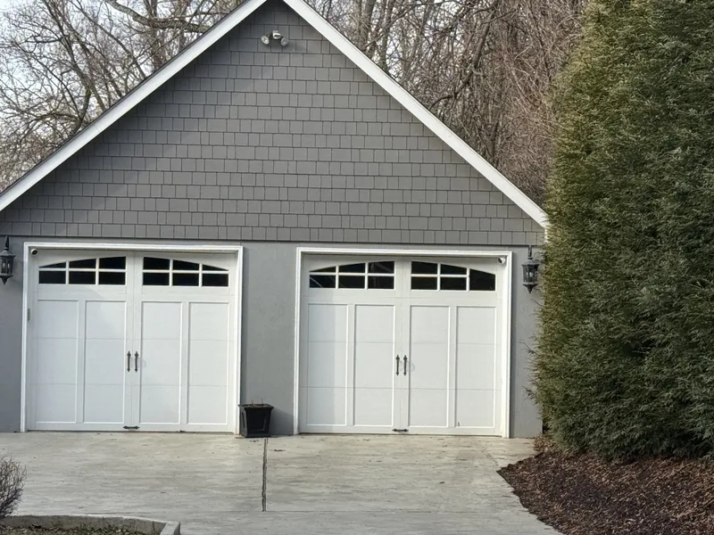 Detached garage sided to match the main house in the same Hardie shingle